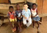 John Sarver Sharing the Gospel with Several Ghanaian Children