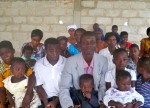 Pastor Collins Agyei with several church members